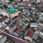 Bendera Merah Putih 400 Meter Membentang di Perumahan Puri Dewata Sambut HUT ke-81 RI